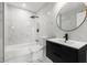 Modern bathroom with a bathtub, shower, and vanity at 1899 Valley Wood Way, Lake Mary, FL 32746