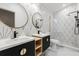 Updated bathroom featuring double sinks, modern fixtures, and a glass shower at 1899 Valley Wood Way, Lake Mary, FL 32746