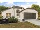 Charming single-story home featuring a two-car garage and well-manicured front yard at 1899 Valley Wood Way, Lake Mary, FL 32746