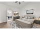 A staged main bedroom with a luxury bath, furniture, decor, and a ceiling fan at 1899 Valley Wood Way, Lake Mary, FL 32746