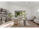 A bright and staged home office with a modern desk and decor with natural lighting at 1899 Valley Wood Way, Lake Mary, FL 32746