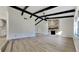 Bright living room boasting a stone fireplace, vaulted ceiling, and modern flooring at 202 Ramsbury Ct, Longwood, FL 32779