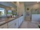 Bathroom featuring double vanity with quartz countertops and glass enclosed shower at 2055 Quiet Cv, Sanford, FL 32771