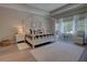 Bedroom with light wood floors, white trim, and a large rug at 2055 Quiet Cv, Sanford, FL 32771