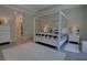 Bedroom featuring a four-poster bed, neutral walls, and light wood floors at 2055 Quiet Cv, Sanford, FL 32771