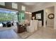 Dining room with a view of the pool offers a modern light fixture and neutral tones at 2055 Quiet Cv, Sanford, FL 32771