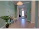 Welcoming foyer boasting blue accent walls, light tile flooring, and bright natural light at 2055 Quiet Cv, Sanford, FL 32771