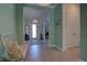 Bright foyer showcasing neutral tile flooring and serene blue walls at 2055 Quiet Cv, Sanford, FL 32771