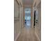 Hallway with wood floors leading to the bedroom at 2055 Quiet Cv, Sanford, FL 32771