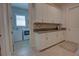 Well-organized laundry room with ample counter space, cabinetry, and modern washer and dryer at 2055 Quiet Cv, Sanford, FL 32771