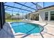 Enjoy the sunshine by the pool with screened enclosure, hardscape, and outdoor furniture at 2055 Quiet Cv, Sanford, FL 32771