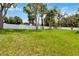 Expansive grassy backyard, featuring a white vinyl fence for added privacy and security at 2341 Oleander Rd, Deland, FL 32724