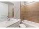 Modern bathroom featuring a white vanity, toilet, and a bathtub with tile surround at 2341 Oleander Rd, Deland, FL 32724