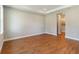 Well-lit bedroom featuring hardwood floors and access to a walk-in closet and bathroom at 2341 Oleander Rd, Deland, FL 32724