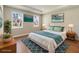 Cozy bedroom with a king bed, stylish rug, and natural light from the windows at 2341 Oleander Rd, Deland, FL 32724