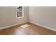 Well-lit bedroom with wood flooring and a window that lets in natural light at 2341 Oleander Rd, Deland, FL 32724