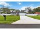 Charming single-story home with a well-manicured lawn and a two-car garage at 2341 Oleander Rd, Deland, FL 32724
