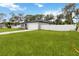A beautiful, modern home with a two-car garage, white fence and a well-manicured lawn at 2341 Oleander Rd, Deland, FL 32724