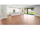 Modern kitchen with white countertops, stainless steel appliances, and sliding glass doors to the backyard at 2341 Oleander Rd, Deland, FL 32724