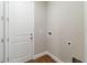 Laundry area featuring tile floor, door to exterior, and a washing machine hookup at 2341 Oleander Rd, Deland, FL 32724