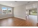 Spacious living area with hardwood floors and a view into the backyard through sliding glass doors at 2341 Oleander Rd, Deland, FL 32724