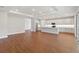 Open floor plan showcasing the kitchen and living area with modern finishes and wood flooring at 2341 Oleander Rd, Deland, FL 32724