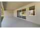 Covered patio featuring concrete flooring, sliding glass doors, and view of the backyard at 2341 Oleander Rd, Deland, FL 32724