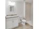 Cozy bathroom with a white vanity, toilet, and a marble-tiled stand-up shower at 23741 Sw Blueberry Ln, Dunnellon, FL 34431