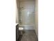 Bright bathroom features shower-tub combination at 2597 Shamrock St, Tavares, FL 32778