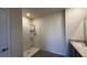 Neutral bathroom with a shower featuring a shower head and built-in shelves at 2597 Shamrock St, Tavares, FL 32778