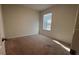 Calm bedroom with natural light streaming through a window at 2597 Shamrock St, Tavares, FL 32778