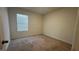 Quiet carpeted bedroom with neutral walls at 2597 Shamrock St, Tavares, FL 32778