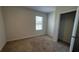 Bedroom with carpeted floor and a window at 2597 Shamrock St, Tavares, FL 32778