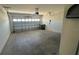 Spacious two-car garage with concrete flooring and cinder block walls at 2597 Shamrock St, Tavares, FL 32778