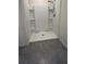 A bathroom shower with white vinyl walls and vinyl base at 2597 Shamrock St, Tavares, FL 32778