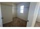 A carpeted walk-in closet with white wire shelving and a window at 2597 Shamrock St, Tavares, FL 32778