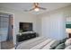 Modern bedroom featuring closet, warm decor, and easy access to laundry area at 2742 Rio Grande Trl, Kissimmee, FL 34741