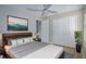 Comfortable bedroom with wood-look floors, soft lighting, and ample closet space at 2742 Rio Grande Trl, Kissimmee, FL 34741