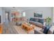 Cozy living room with a comfortable sofa, modern furniture, and lots of natural light at 2742 Rio Grande Trl, Kissimmee, FL 34741