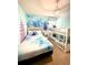 Charming bedroom with a fun Frozen theme, bunk beds, and a whimsical aesthetic at 3044 Mahalo Dr, Davenport, FL 33897