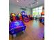 Vibrant game room featuring a variety of arcade games and entertainment options for residents of all ages at 3044 Mahalo Dr, Davenport, FL 33897