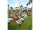 Attractive mini golf course with artificial turf, decorative rocks, and lush landscaping, perfect for Gathering fun at 3044 Mahalo Dr, Davenport, FL 33897