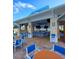 Modern poolside bar with ample seating, televisions, and a lively atmosphere for residents and guests at 3044 Mahalo Dr, Davenport, FL 33897