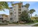 Multi-story condo building featuring balconies, well-manicured landscaping, and secure entrances at 311 E Morse Blvd # 6-7, Winter Park, FL 32789