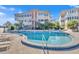 Community pool with chairs and lounges surrounded by mature trees at 311 E Morse Blvd # 6-7, Winter Park, FL 32789