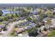 Wide aerial view of a neighborhood featuring multiple lakes and ponds, offering a picturesque and scenic environment at 323 Shadow Oak Dr, Casselberry, FL 32707