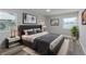 Nicely staged bedroom with a large cozy bed and stylish decor at 323 Shadow Oak Dr, Casselberry, FL 32707