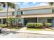 Two-story townhouse boasting tropical landscaping and a screened entry at 40 Moree Loop # 11, Winter Springs, FL 32708