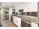 Bright kitchen featuring granite countertops, stainless steel appliances, and modern backsplash at 40 Moree Loop # 11, Winter Springs, FL 32708