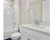 Bathroom features a vanity with modern fixtures, a quartz countertop and a shower and bathtub combination at 4418 Lions Gate Ave, Clermont, FL 34711